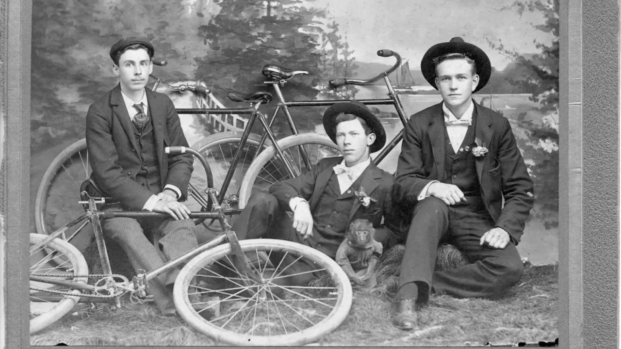 Black and white photograph from Ivey Family London Room, London Public Library. Group Portrait of Three Cyclists, London, Ontario.