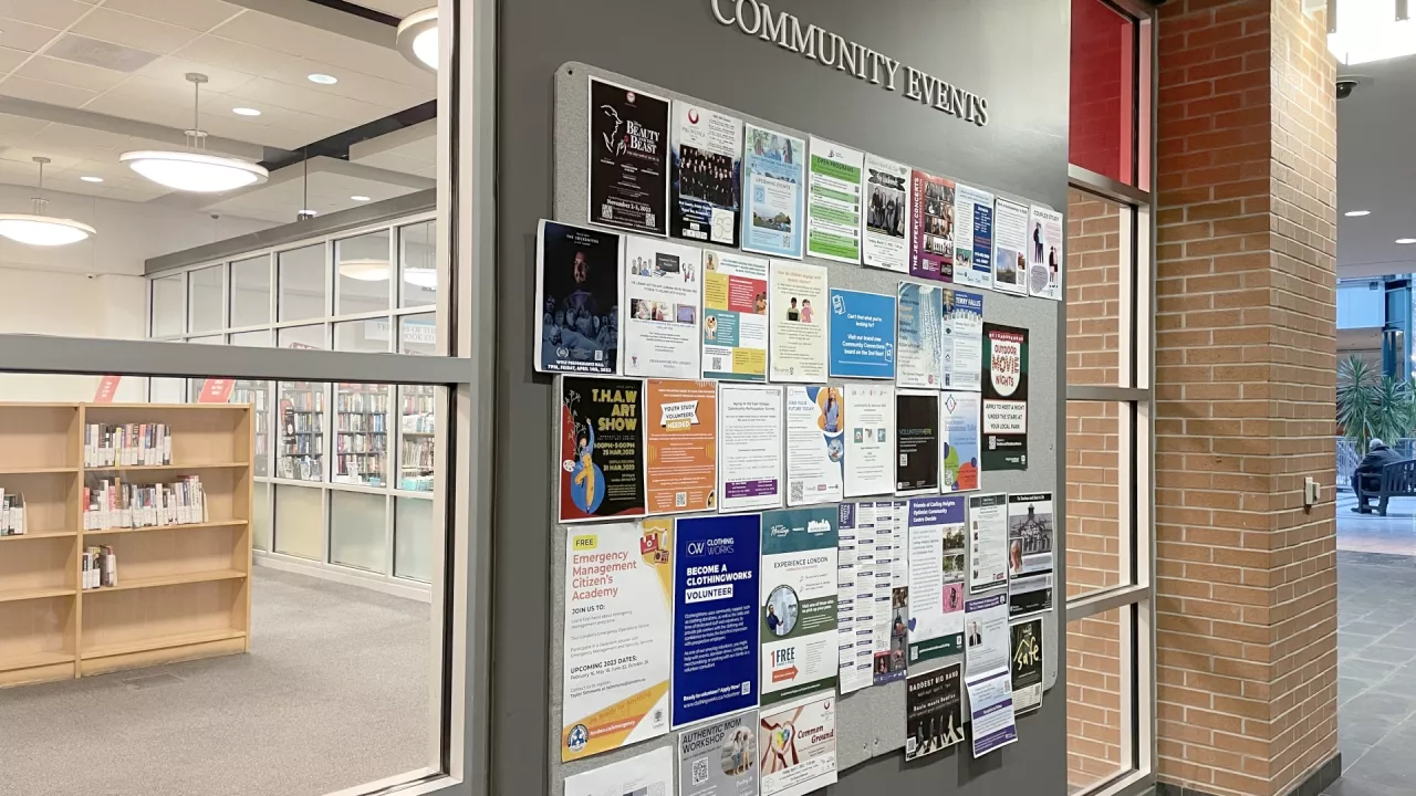 Photo of the Community Events Bulletin board at Central Library with posters on display.