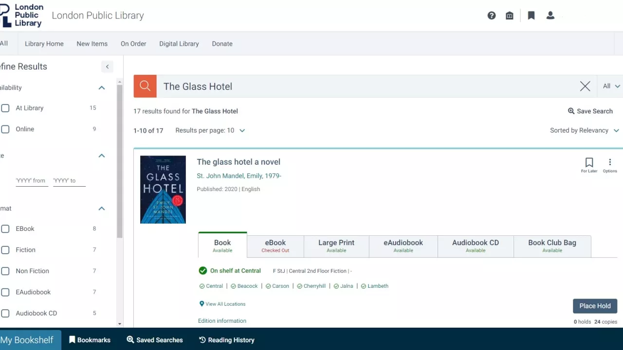 Screenshot of the Library's new catalogue showing a search for the title The Glass Hotel: a novel by Emilly St. John Mandel. The cover of the book is displauyed and below that are tabs showing the availability of the Book, eBook, Large Print, eAudiobook, Audiobook CD and Book Club Bag. Below the tabs the locations at which the title is available are displayed. 