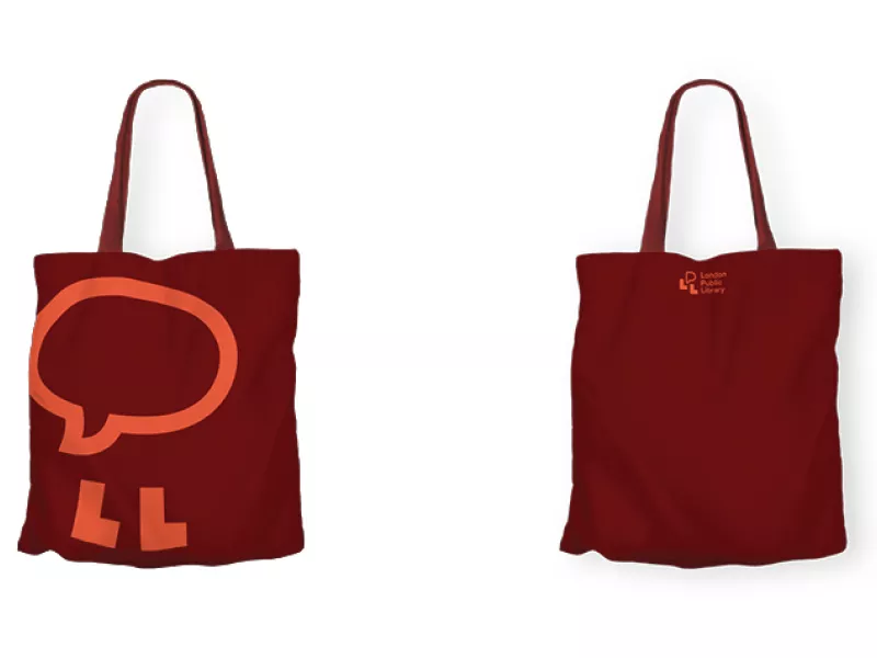 LPL Tote bag in dark red with a simple light red speech bubble character illustration on the front and small centered logo on the back