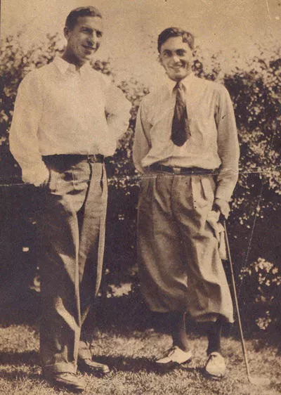 Black and white photograph of two male golfers