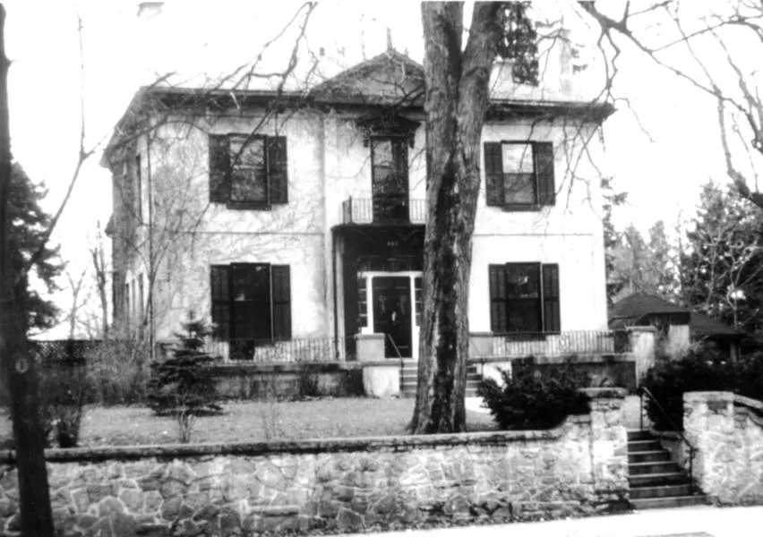 Black and white photograph of a two story house