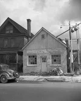 Black and white photograph of the Toddle Inn. Looking east on Richmond street